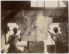 Stonecutters carving ornate capital